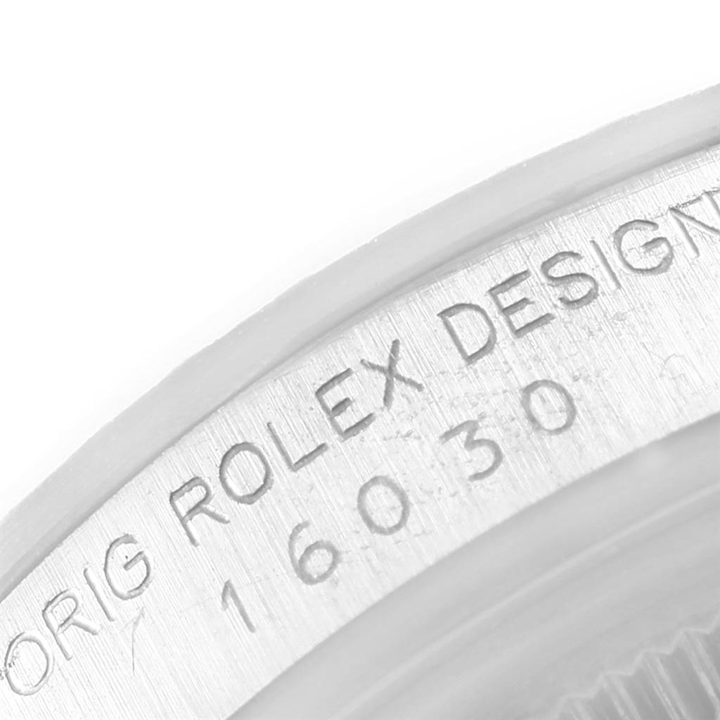 This close-up image shows the engraved side of the bezel on a Vintage Collection Rolex watch.