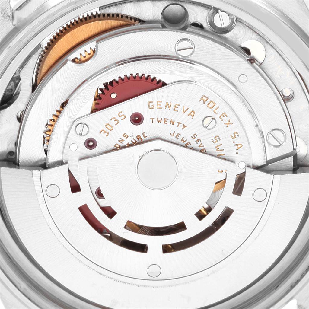 This image shows a close-up of the inner mechanism of the Vintage Collection Rolex watch, highlighting its gears and intricate parts.