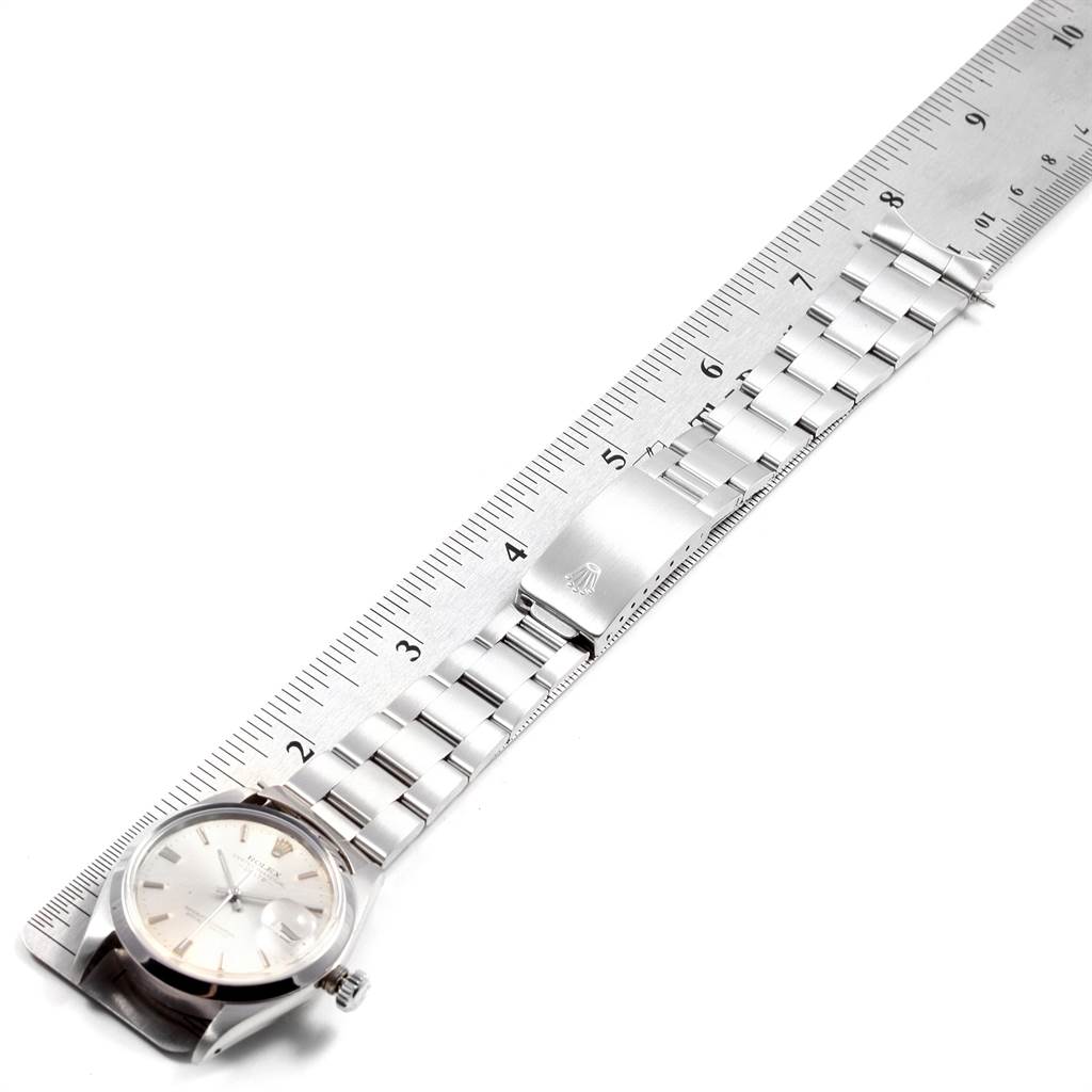 A Vintage Rolex Collection watch is shown horizontally with a ruler placed alongside, displaying the wristband length and clasp.