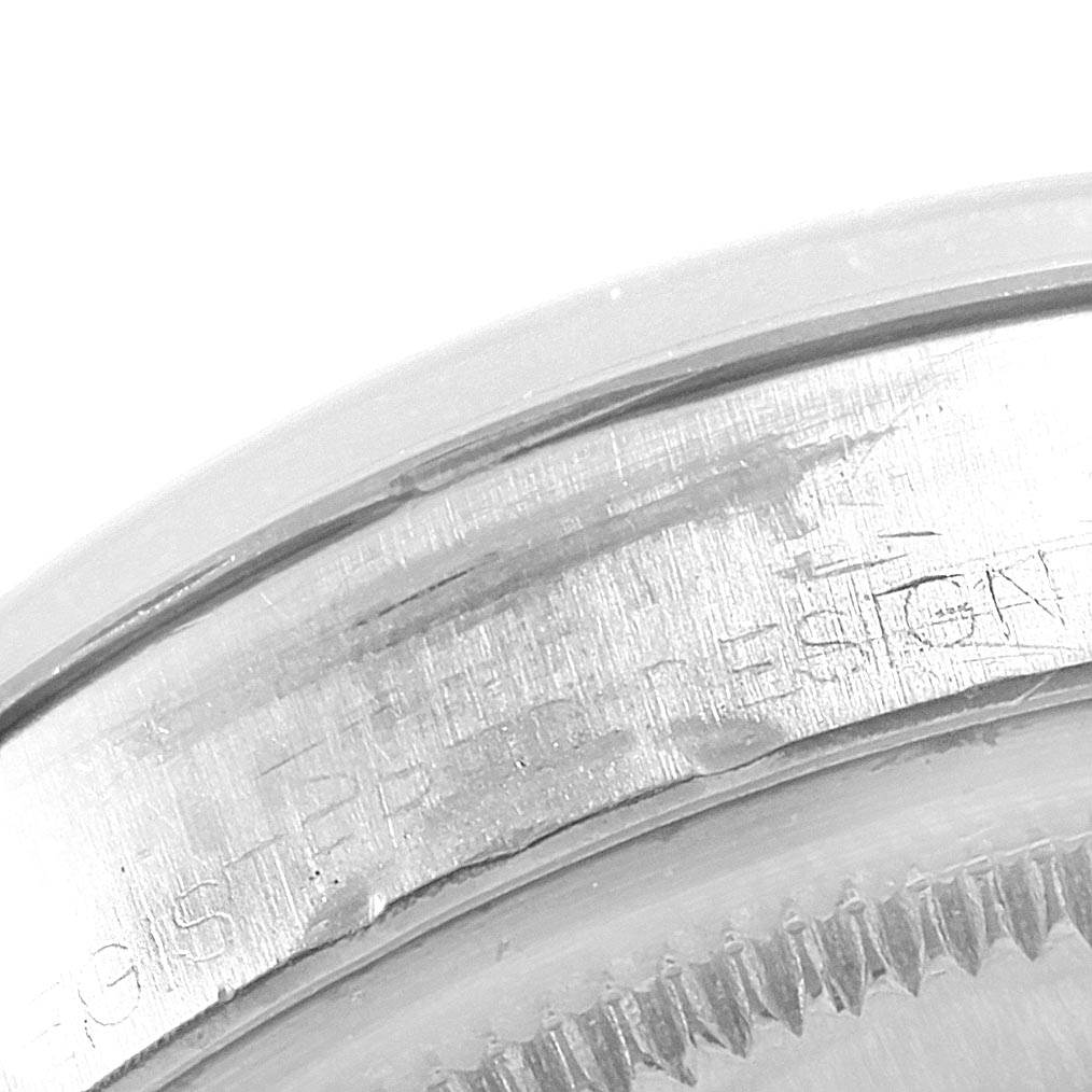 This image shows a close-up angle of the engraved text on the case back rim of the Rolex Vintage Collection 1500 Men's Stainless Steel Silver Dial 1500 Men's Stainless Steel Silver Dial model.