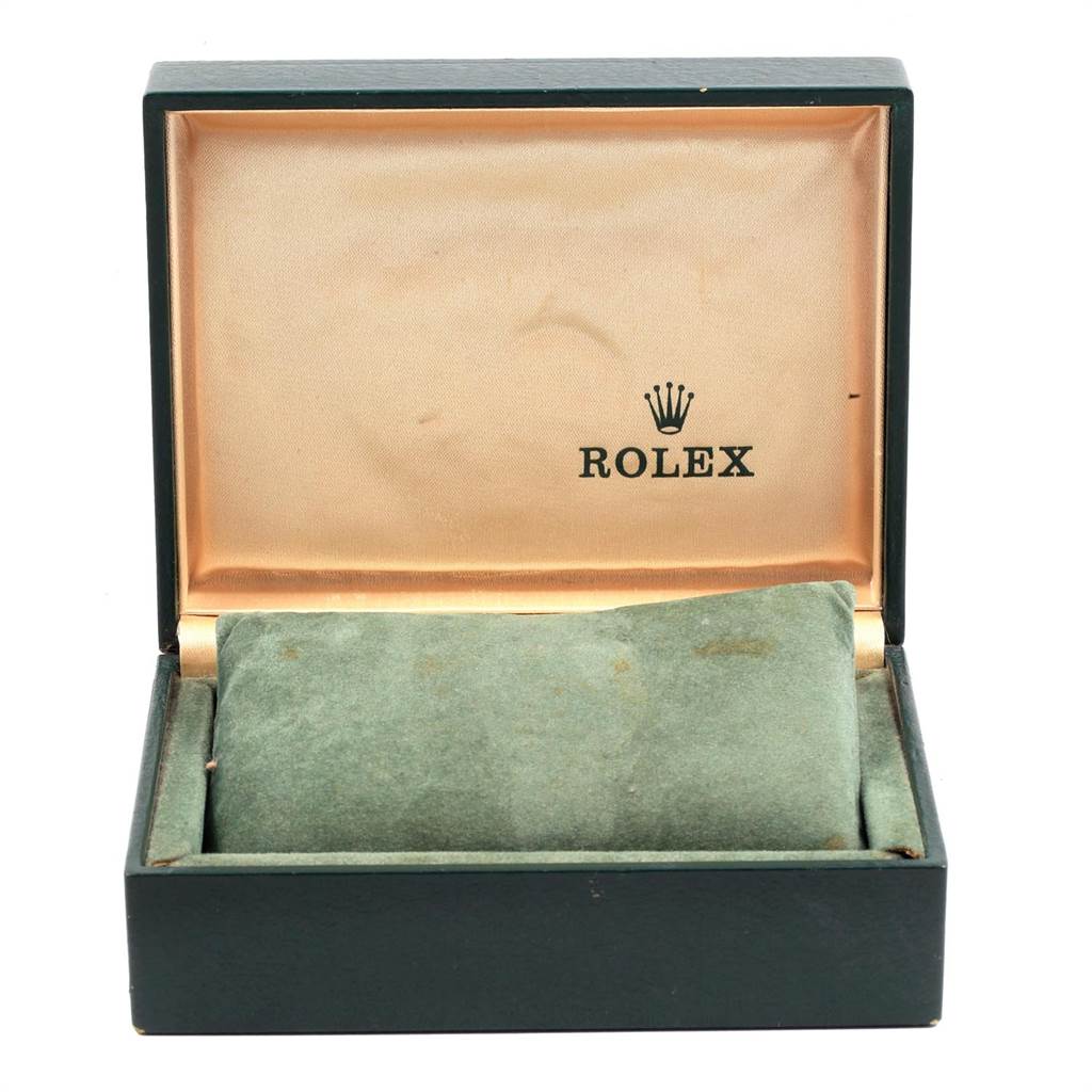 The image shows an open box for the Rolex Vintage Collection 1500 Men's Stainless Steel Silver Dial 1500 Men's Stainless Steel Silver Dial model watch with a green cushioned interior and the Rolex brand logo.