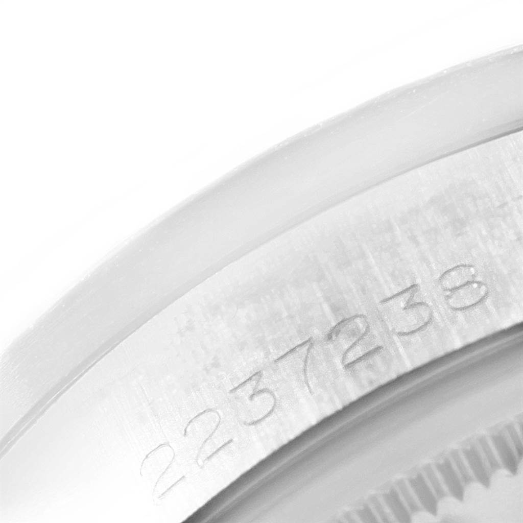 This image shows a close-up view of the serial number engraved on the rim of a Rolex Vintage Collection 1501 Men's Stainless Steel Silver Dial 1501 Men's Stainless Steel Silver Dial model watch.