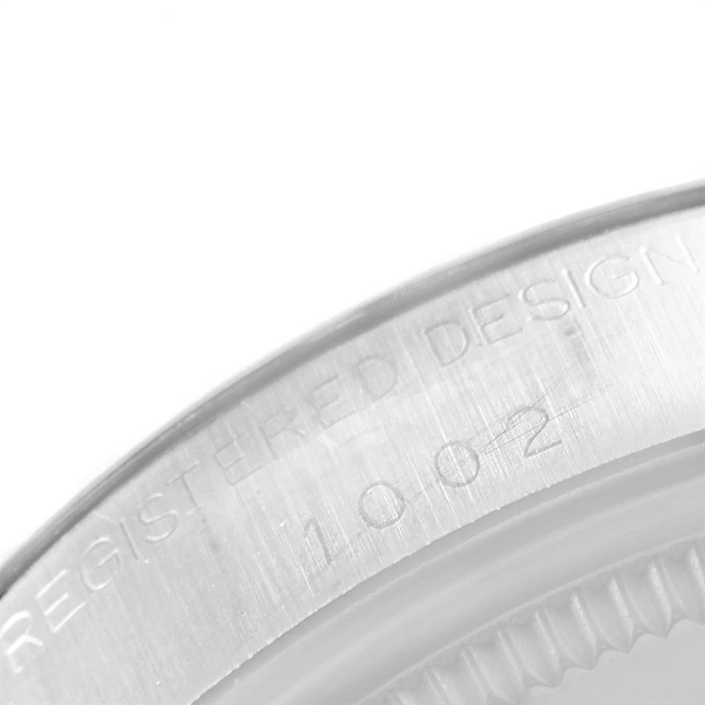 This image shows a close-up of the engraved back case of a Vintage Collection Rolex watch, displaying its model number.