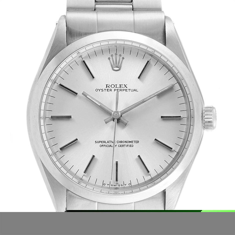 The image shows a front view of a Rolex Vintage Collection 1002 Men's Stainless Steel Silver Dial 1002 Men's Stainless Steel Silver Dial Oyster Perpetual watch, displaying its face, dial, crown, and a portion of the bracelet.