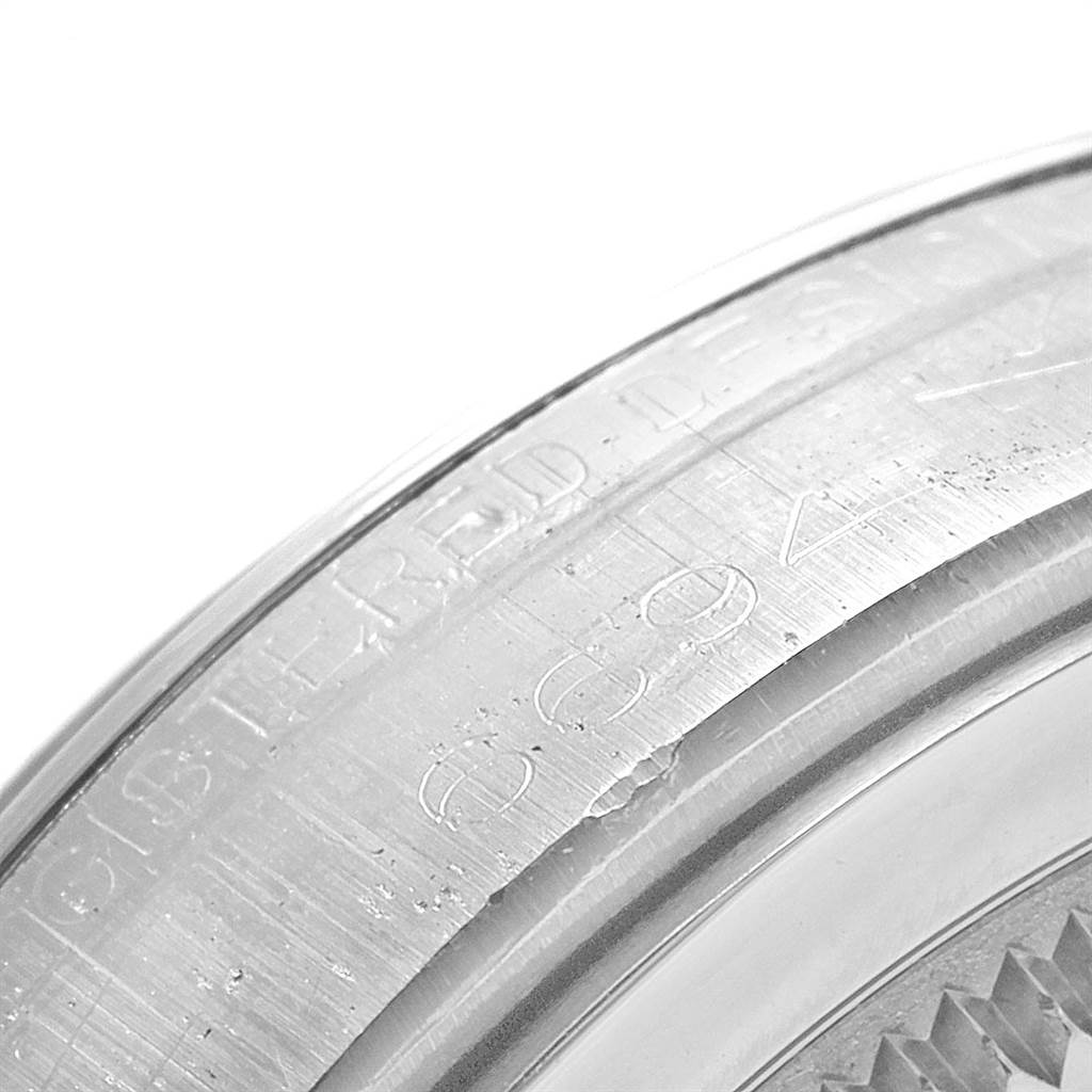 This image shows a close-up of the engraved bezel of the Rolex Vintage Collection 6694 Men's Stainless Steel Silver Dial 6694 Men's Stainless Steel Silver Dial watch.