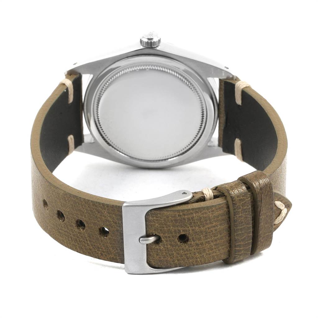 This image shows the back view of the casing and brown leather strap of a Rolex Vintage Collection 6694 Men's Stainless Steel Silver Dial 6694 Men's Stainless Steel Silver Dial watch.