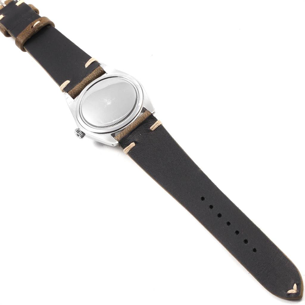 This image shows the back and band of a Vintage Collection model by Rolex, laid flat.