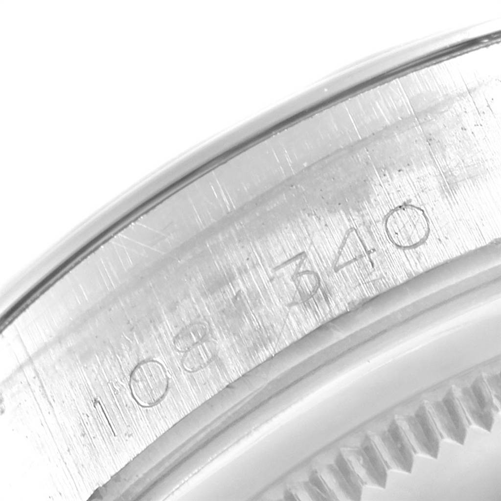This close-up image shows the serial number engraved on the side of the Rolex Vintage Collection 6694 Men's Stainless Steel Silver Dial 6694 Men's Stainless Steel Silver Dial watch case.