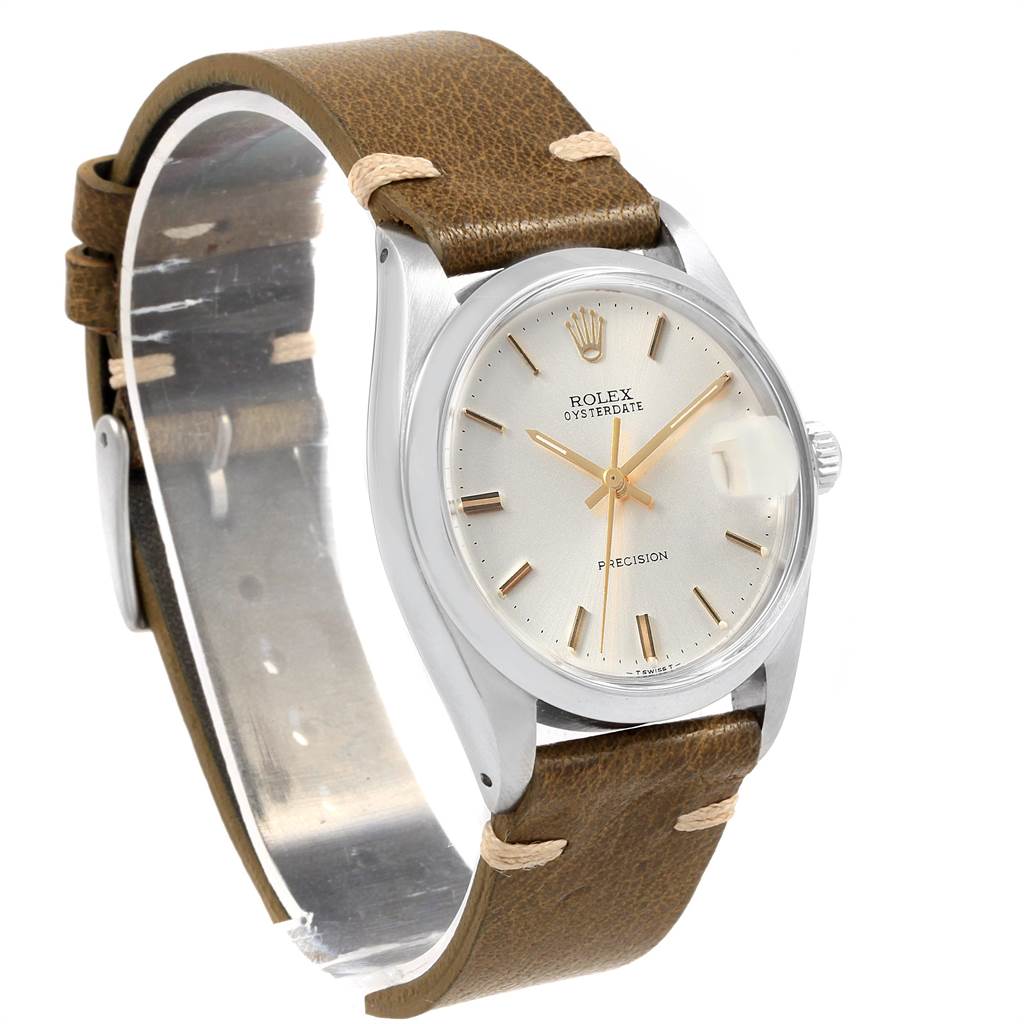 The image shows a three-quarters angle of a Rolex Vintage Collection 6694 Men's Stainless Steel Silver Dial 6694 Men's Stainless Steel Silver Dial watch with a brown leather strap and a silver dial.