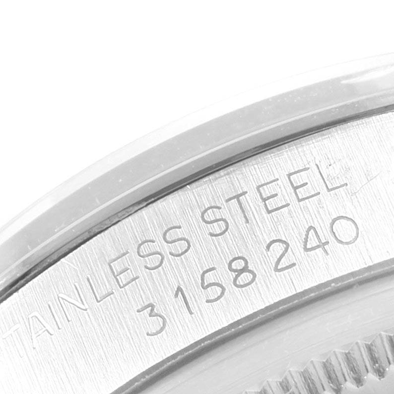 This close-up angle shows the stainless steel back of the Rolex Vintage Collection 1500 Men's Stainless Steel Silver Dial 1500 Men's Stainless Steel Silver Dial watch with its serial number.