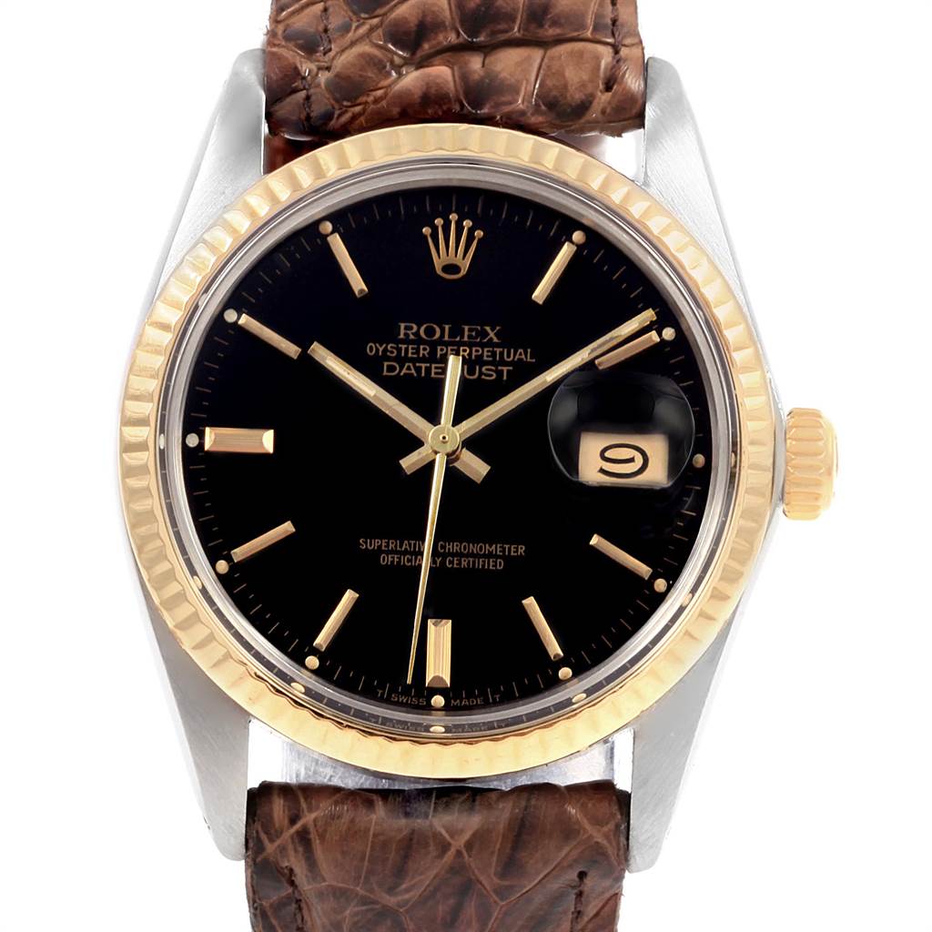 The image shows a front view of the Rolex Vintage Collection 16013 Men's Stainless Steel Black Dial 16013 Men's Stainless Steel Black Dial Oyster Perpetual Datejust watch, highlighting the dial, bezel, and leather strap.