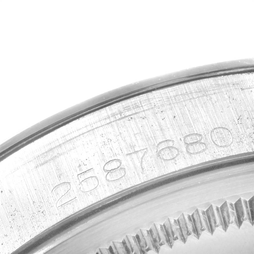 This image shows a close-up of the serial number engraving on the case back of a Rolex Vintage Collection 1500 Men's Stainless Steel Silver Dial 1500 Men's Stainless Steel Silver Dial model.
