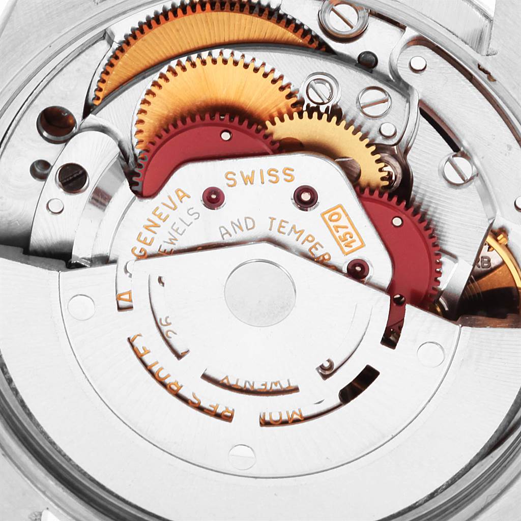 The image shows a close-up of the movement mechanism of a Rolex Vintage Collection 1002 Men's Stainless Steel Silver Dial 1002 Men's Stainless Steel Silver Dial model watch.