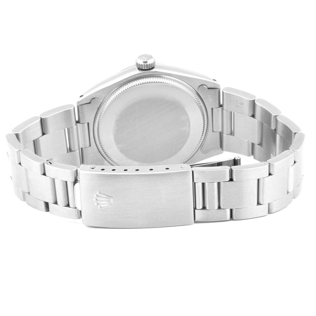 The image shows the back case and metal bracelet of a Rolex Vintage Collection 1002 Men's Stainless Steel Silver Dial 1002 Men's Stainless Steel Silver Dial watch.