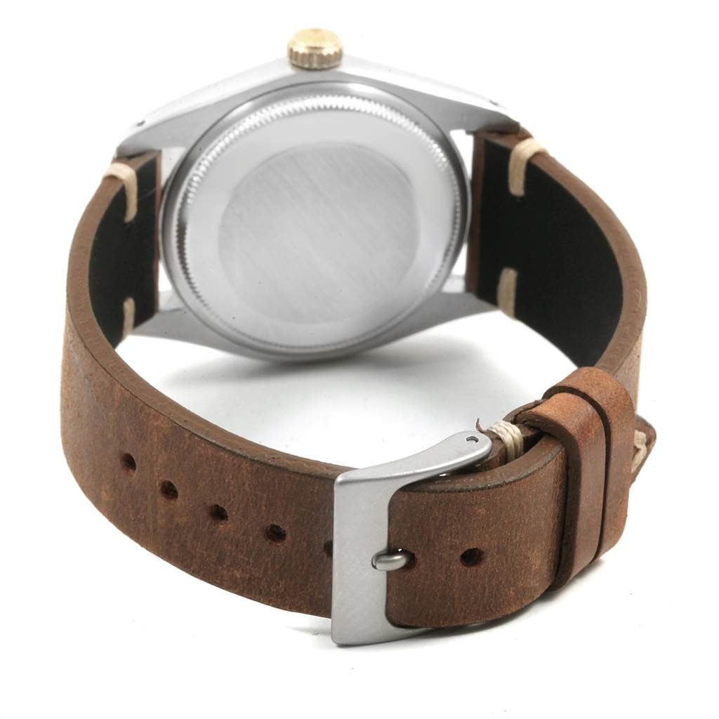 The image shows the back case and leather strap of the Rolex Vintage Collection 1500 Men's Stainless Steel Silver Dial 1500 Men's Stainless Steel Silver Dial watch from a rear angle.