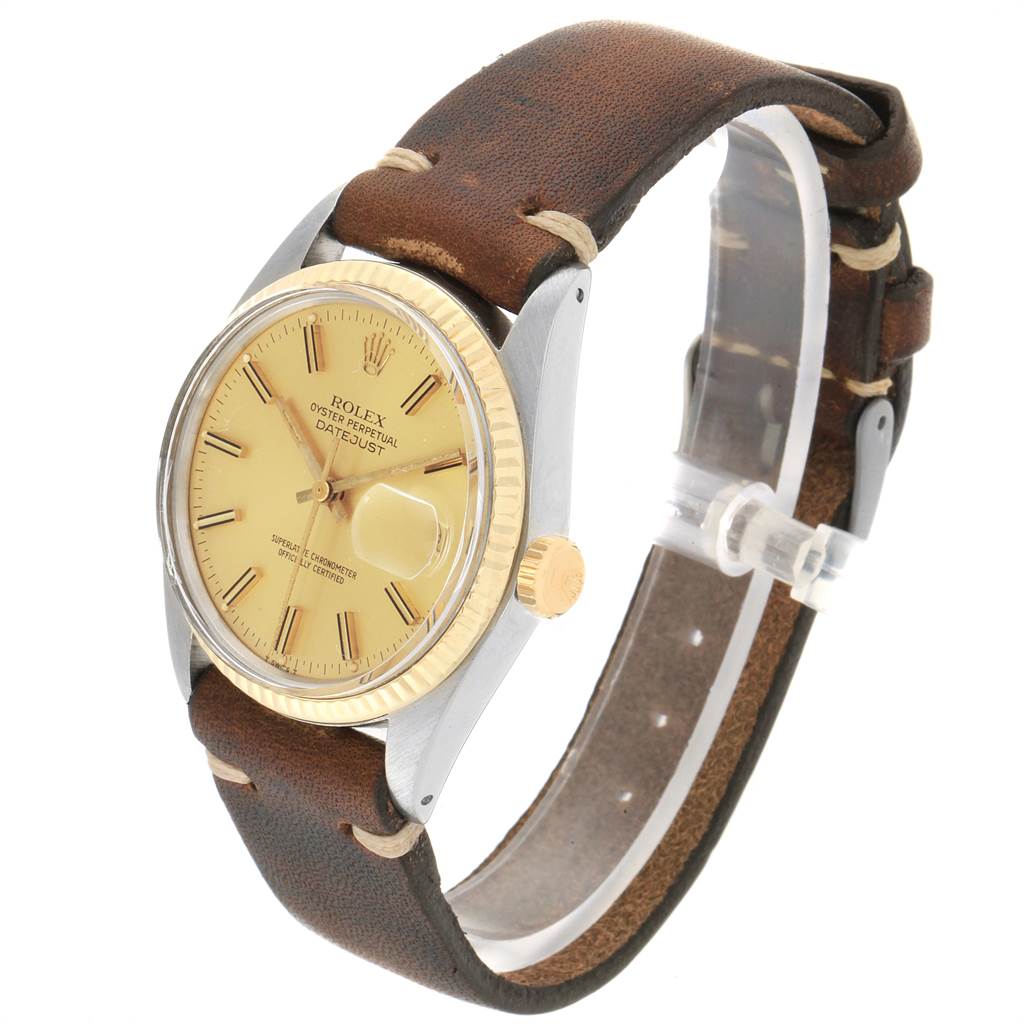 This image shows a Rolex Vintage Collection 16013 Men's Stainless Steel Champagne Dial 16013 Men's Stainless Steel Champagne Dial Datejust watch at a three-quarter angle, displaying its face, bezel, crown, and leather strap.