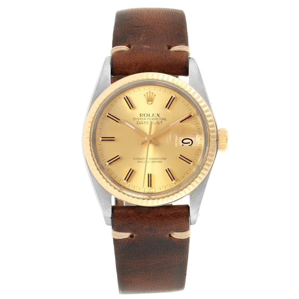 The image shows a Rolex Vintage Collection 16013 Men's Stainless Steel Champagne Dial 16013 Men's Stainless Steel Champagne Dial Datejust watch with a brown leather strap, gold dial, and fluted bezel from a front angle.