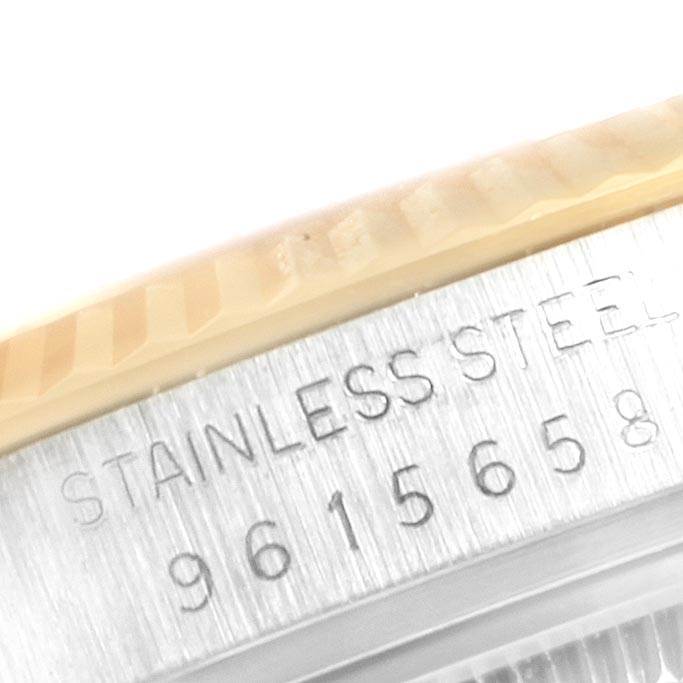 Close-up of the side of a Rolex Vintage Collection 16013 Men's Stainless Steel Champagne Dial 16013 Men's Stainless Steel Champagne Dial watch, showing the stainless steel casing and serial number.