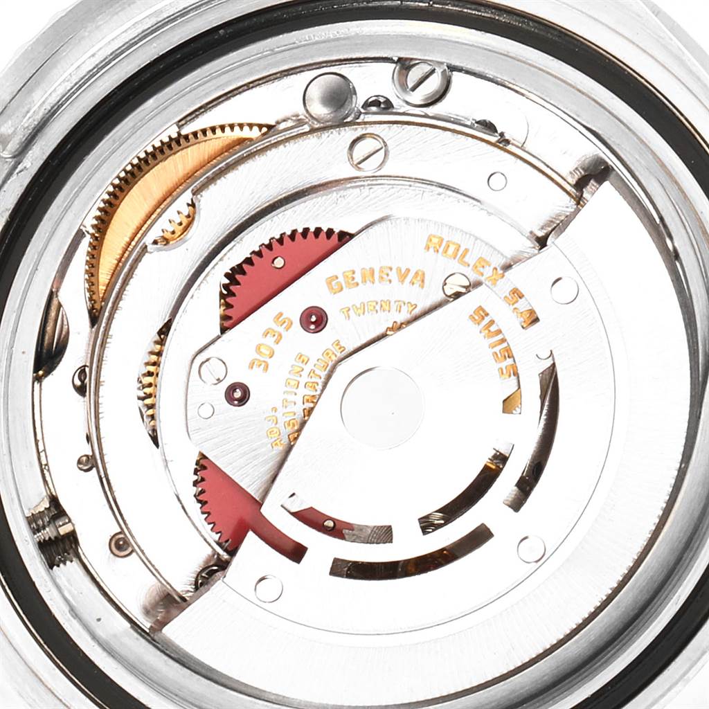 This is an image of the mechanical movement inside the Rolex Vintage Collection 16800 Men's Stainless Steel Black Dial 16800 Men's Stainless Steel Black Dial watch, showing gears and the rotor.