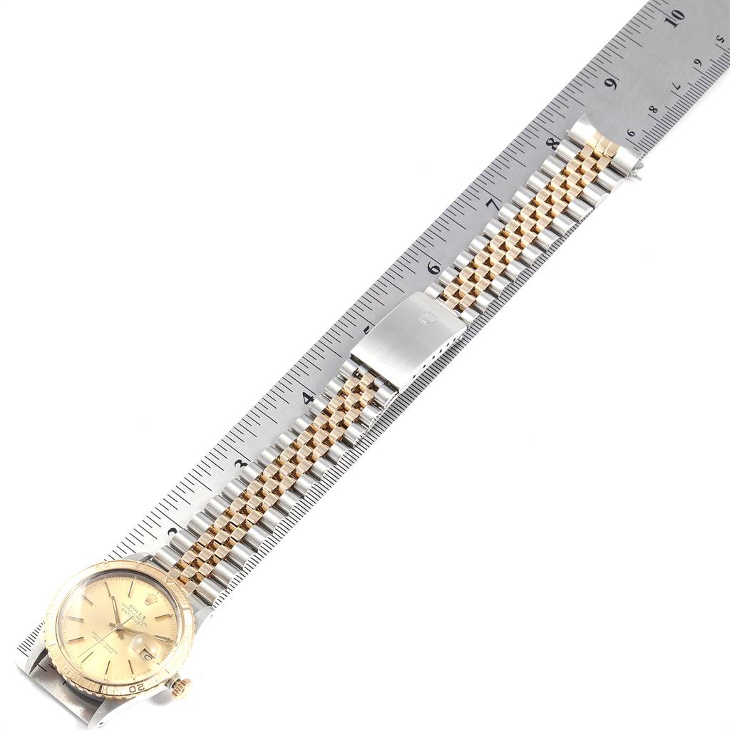 This image shows a top view of a Rolex Vintage Collection 16253 Men's Steel and Gold (two tone) Champagne Dial 16253 Men's Steel and Gold (two tone) Champagne Dial watch with a ruler measuring its bracelet.