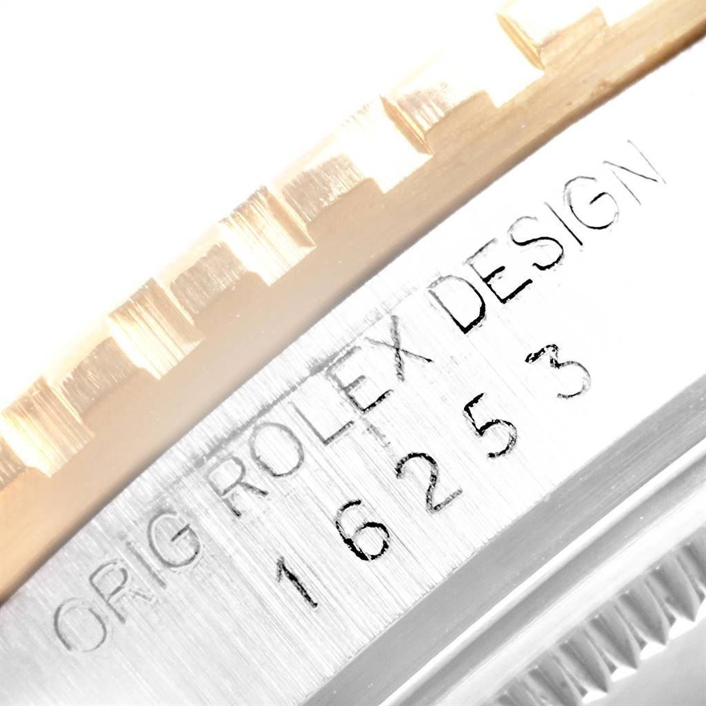 This close-up image shows the side of the bezel and case of a Rolex Vintage Collection 16253 Men's Steel and Gold (two tone) Champagne Dial 16253 Men's Steel and Gold (two tone) Champagne Dial model, displaying the engraved model number.