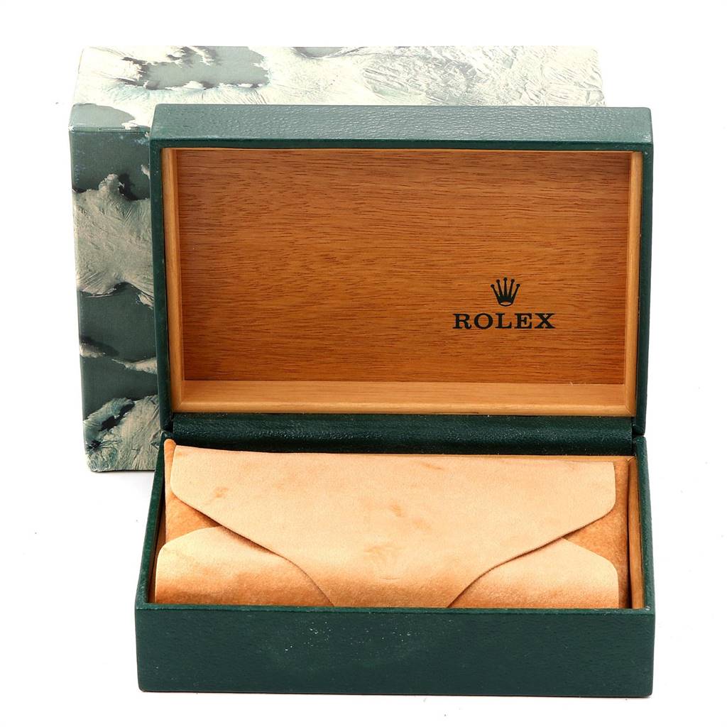 The image shows an open, empty box for a Vintage Collection Rolex watch, revealing a beige leather pouch inside.