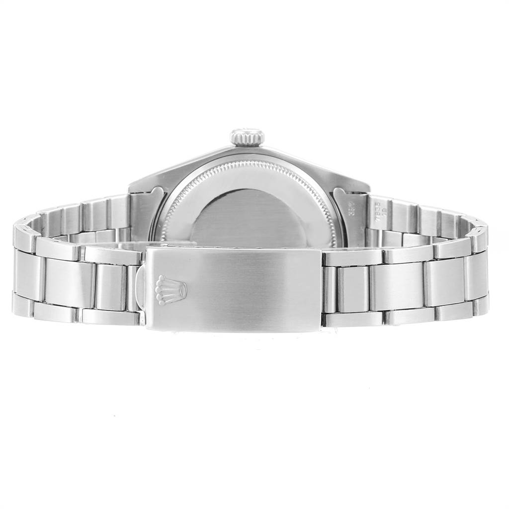 The image shows the back and bracelet of a Vintage Collection Rolex watch, focusing on the clasp and case back.