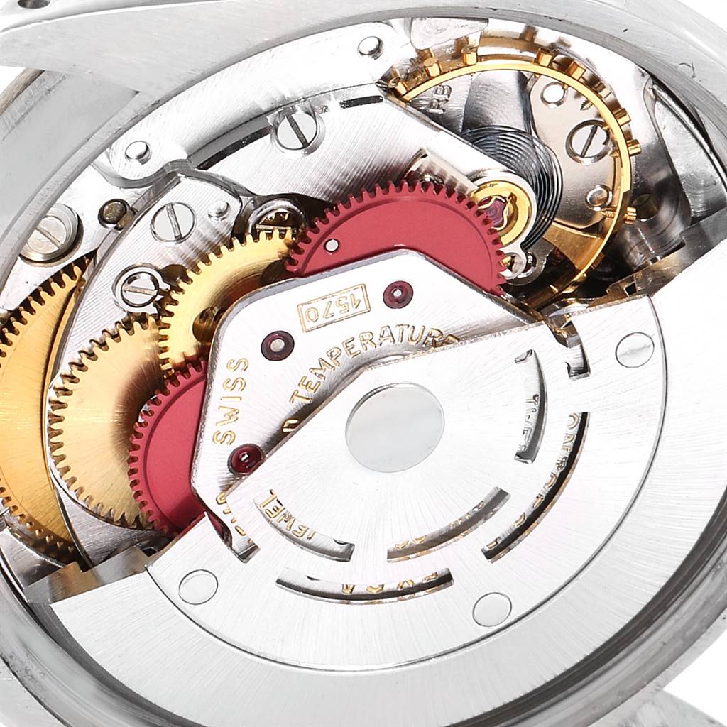 This image shows a close-up view of the inner mechanical movement parts of a Vintage Collection Rolex watch.