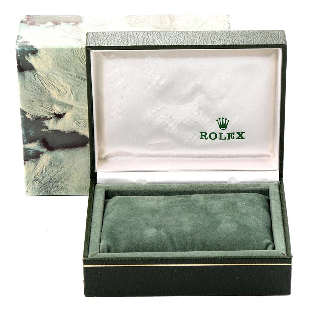 The image shows an empty green and white Rolex watch box for the Vintage Collection model.