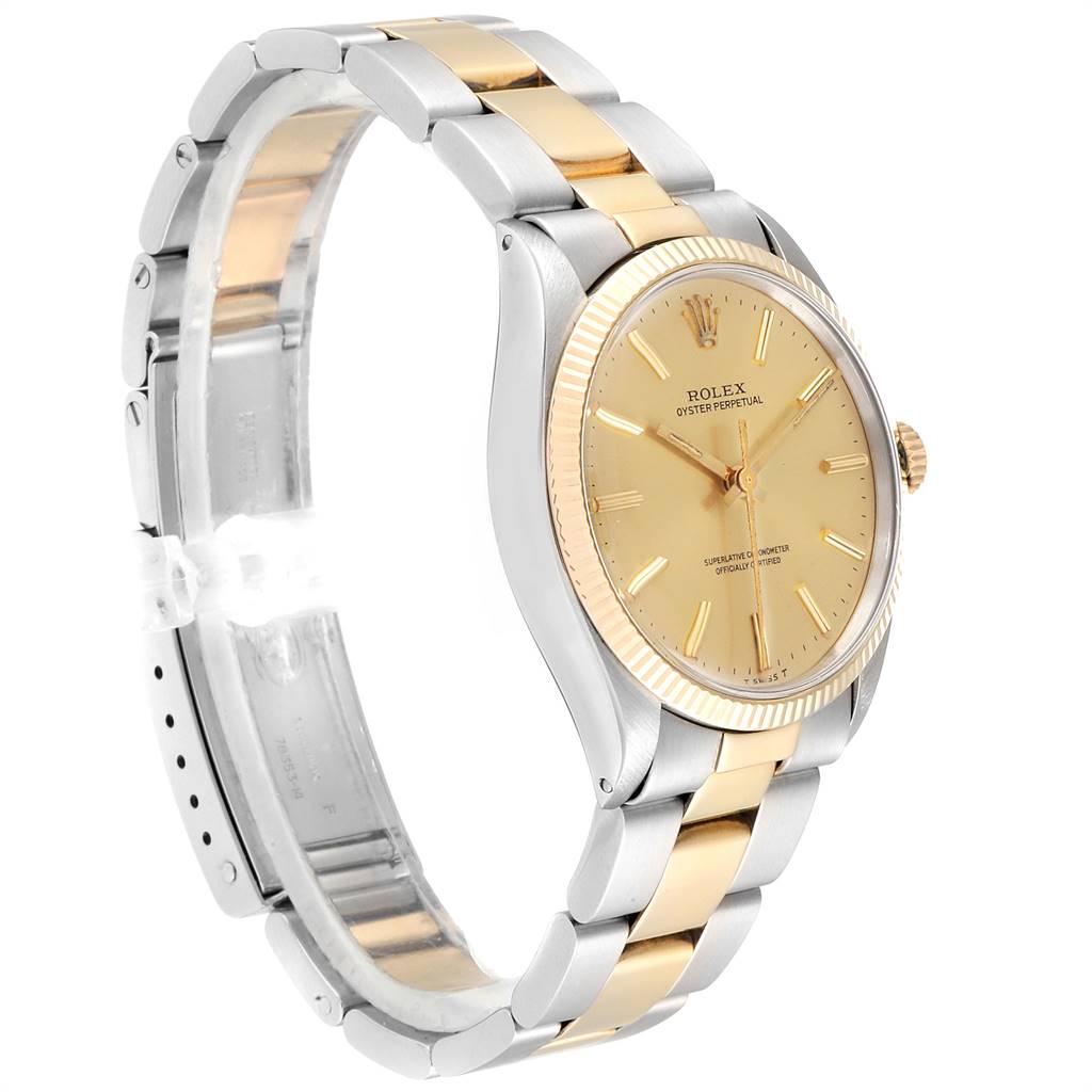 The image shows a side angle of the Rolex Vintage Collection 1005 Men's Steel and Gold (two tone) Champagne Dial 1005 Men's Steel and Gold (two tone) Champagne Dial watch, displaying its gold and silver bracelet and face.