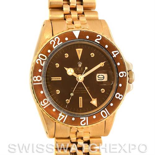 This image shows a front view of the Rolex Vintage Collection 1675 Men's Yellow Gold Brown Dial 1675 Men's Yellow Gold Brown Dial watch, featuring its dial, bezel, and part of the bracelet.