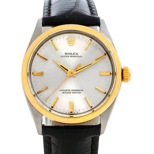 The Vintage Collection Rolex watch is shown from a front angle, displaying its dial, bezel, and crown with a leather strap.