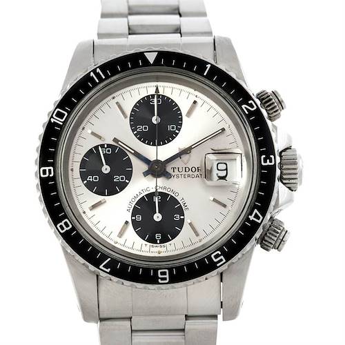 The image shows a front view of the Tudor Oysterdate Automatic-Chrono Time watch, featuring a stainless steel bracelet, black bezel, and three sub-dials.