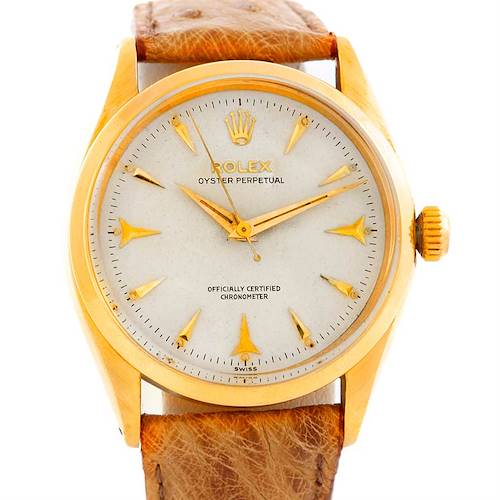 The image shows a front view of the Rolex Vintage Collection 6564 Men's Yellow Gold Silver Dial 6564 Men's Yellow Gold Silver Dial model, displaying the dial, hands, case, crown, and leather strap.