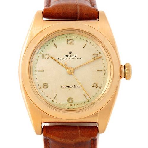 The image shows a front view of the Rolex Vintage Collection 3131 Men's Yellow Gold Silver Dial 3131 Men's Yellow Gold Silver Dial Oyster Perpetual watch with a gold case and brown leather strap.