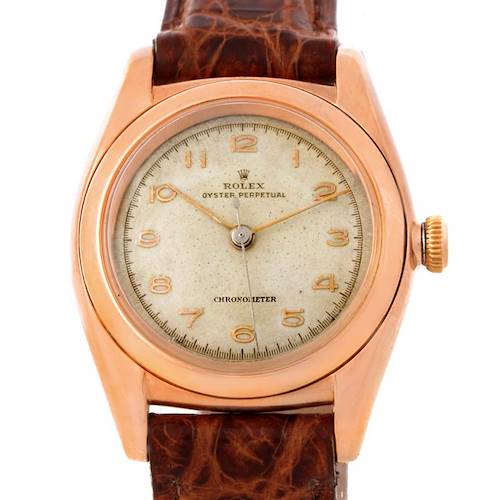 The image shows a front-facing view of a Rolex Vintage Collection 3131 Men's Rose Gold Silver Dial 3131 Men's Rose Gold Silver Dial watch, including its dial, casing, crown, and part of the leather strap.