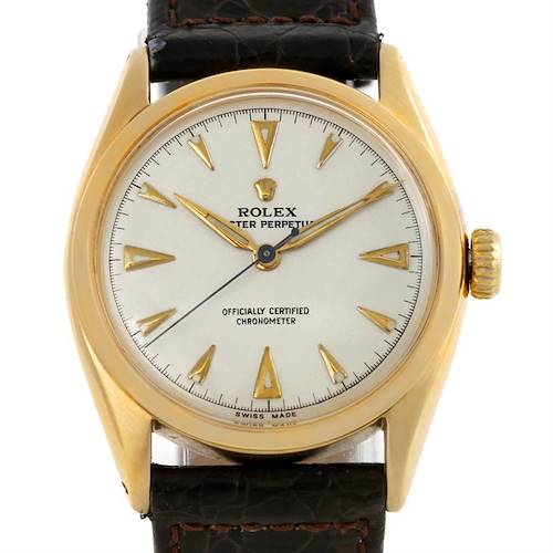 The Rolex Vintage Collection 6084 Men's Yellow Gold Silver Dial 6084 Men's Yellow Gold Silver Dial watch is shown from a direct front angle, displaying the dial, hands, markers, case, and strap.