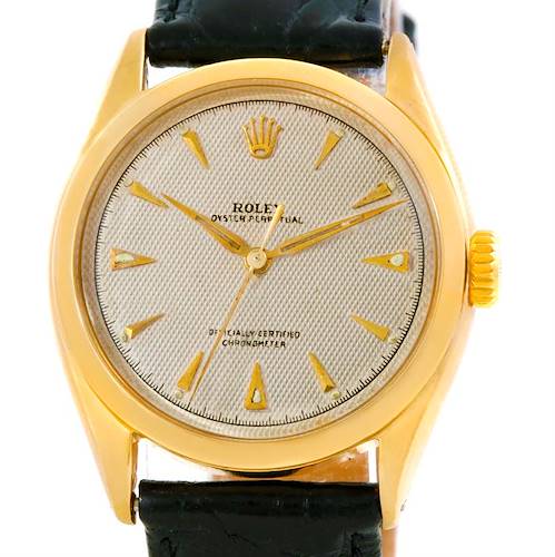 The image shows a frontal view of the dial, case, and part of the strap of the Vintage Collection model by Rolex.
