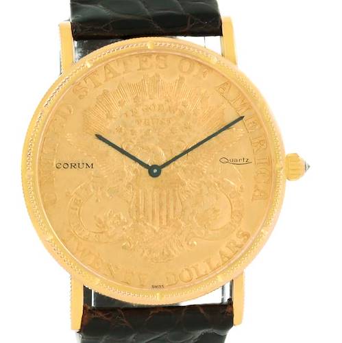 The image shows a Corum Coin Watch Men's Yellow Gold Black Dial Men's Yellow Gold Black Dial model, featuring its gold coin dial, black hands, and leather strap, viewed from the front.