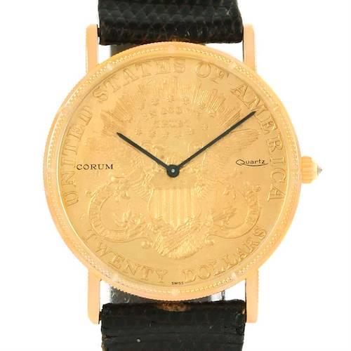 The image shows a front view of the Corum Coin Watch Men's Yellow Gold Black Dial Men's Yellow Gold Black Dial model with visible face, hands, and strap.