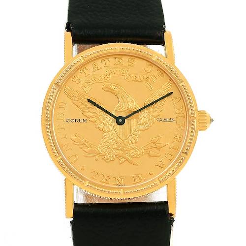 The image shows a front view of a Corum Women's Yellow Gold Black Dial Women's Yellow Gold Black Dial 18K Yellow Gold $10 Coin Ladies Watch, with the dial, hands, case, and part of the strap visible.