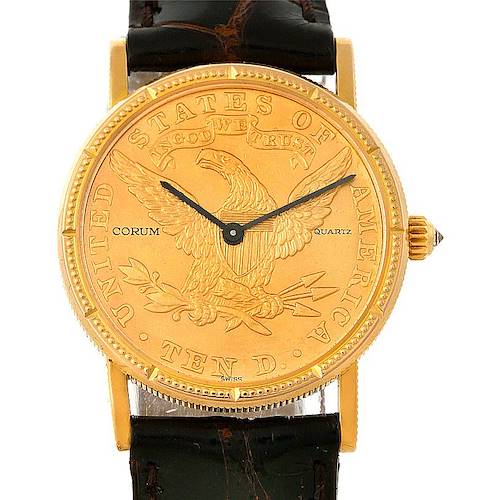 The image shows a front view of the Corum Women's Yellow Gold Black Dial Women's Yellow Gold Black Dial Ladies 18K Yellow Gold 10 Dollars Coin Watch, highlighting its intricate coin dial and leather strap.
