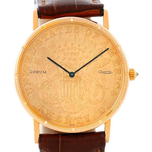 The image shows a frontal view of the Corum Coin Watch Men's Yellow Gold Black Dial Men's Yellow Gold Black Dial model, highlighting its gold coin dial and brown leather strap.