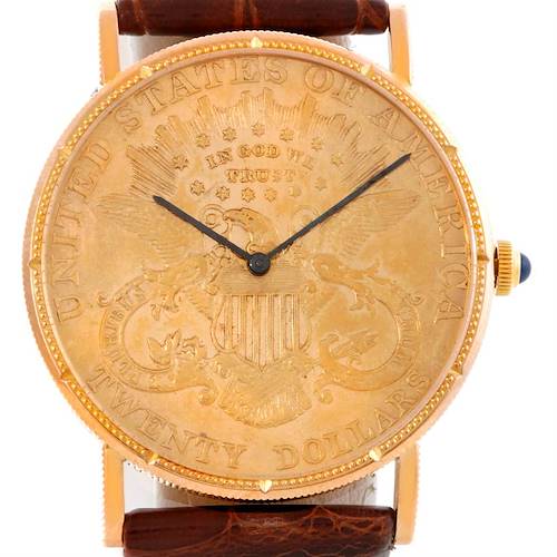 The image shows the front view of a Corum Coin Watch Men's Yellow Gold Black Dial Men's Yellow Gold Black Dial model, highlighting its coin-inspired dial and leather strap.