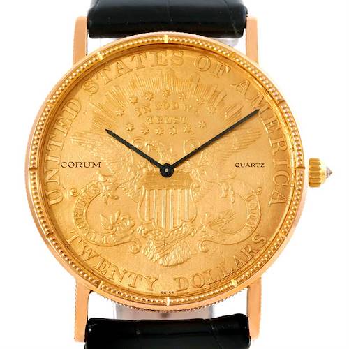 The image shows a frontal view of the Corum Coin Watch Men's Yellow Gold Black Dial Men's Yellow Gold Black Dial model, displaying its gold coin dial and black hands.