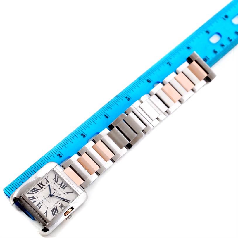 The Cartier Tank Anglaise W5310006 Men's Steel and Gold (two tone) Silver Dial W5310006 Men's Steel and Gold (two tone) Silver Dial watch is shown from an overhead angle with a ruler placed alongside its band for measurement.