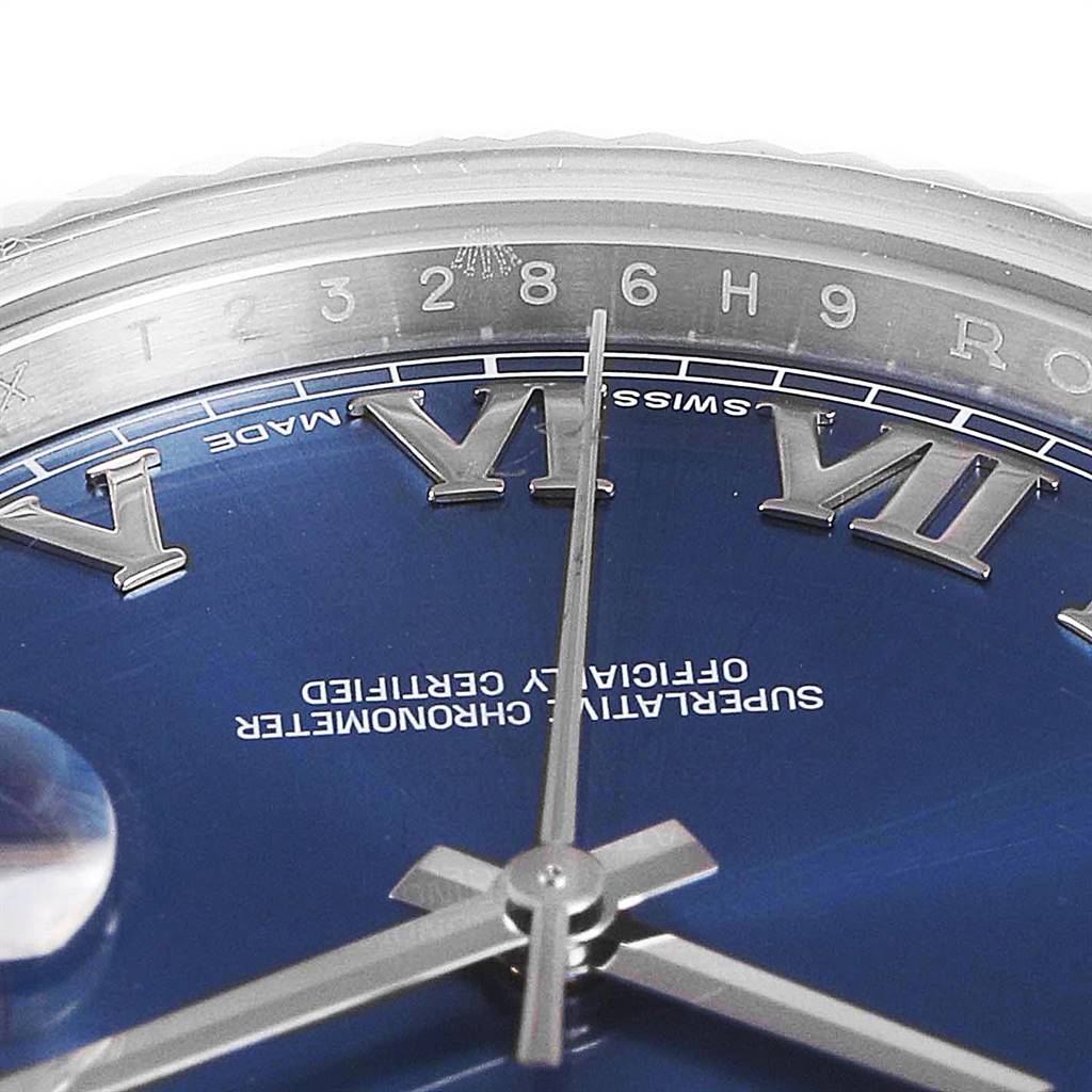 The image shows a close-up of the dial and bezel of a Rolex Datejust 41 116334 Men's Stainless Steel Blue Dial 116334 Men's Stainless Steel Blue Dial watch, highlighting the Roman numerals and central hands.