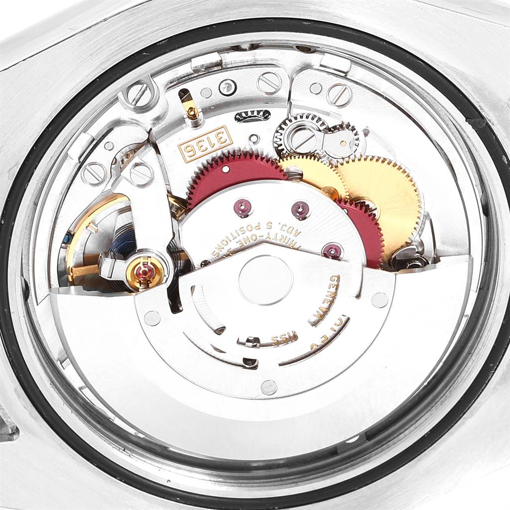 The image shows the internal mechanism of a Rolex Datejust 41 116334 Men's Stainless Steel Blue Dial 116334 Men's Stainless Steel Blue Dial watch from a close-up angle, highlighting its intricate gears and components.