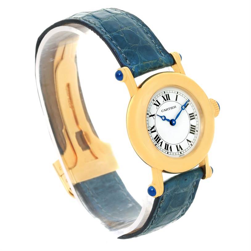 The Diabolo model by Cartier is displayed at an angle showing the face, strap, and gold-colored casing.