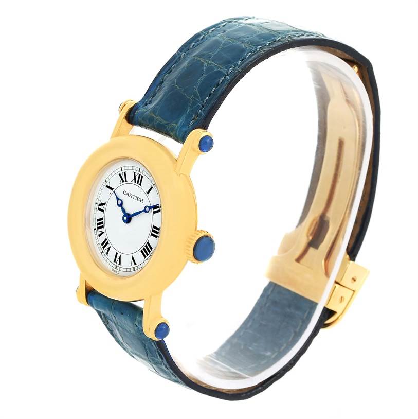 This image shows a Diabolo model by Cartier from a side angle, highlighting the watch face, blue strap, and gold case.